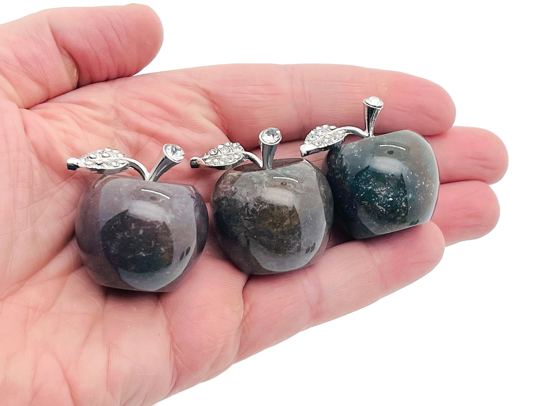 Moss agate apple-shaped crystal carving, 30mm, from GemstoneGO, showcasing detailed green and brown natural stone patterns.
