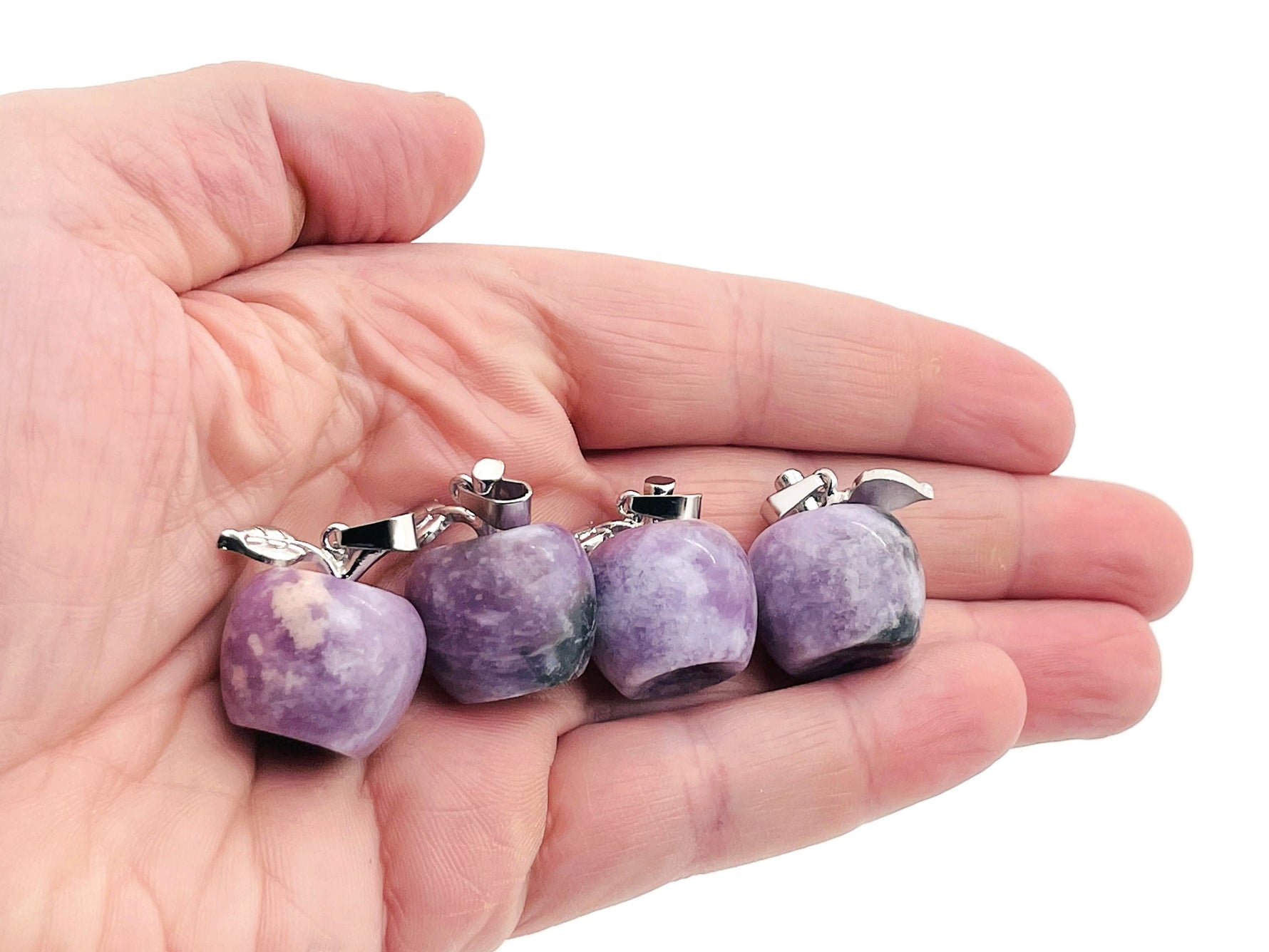 Lepidolite apple-shaped crystal pendant by GemstoneGO featuring a mini crystal pendant with purple and pink hues.