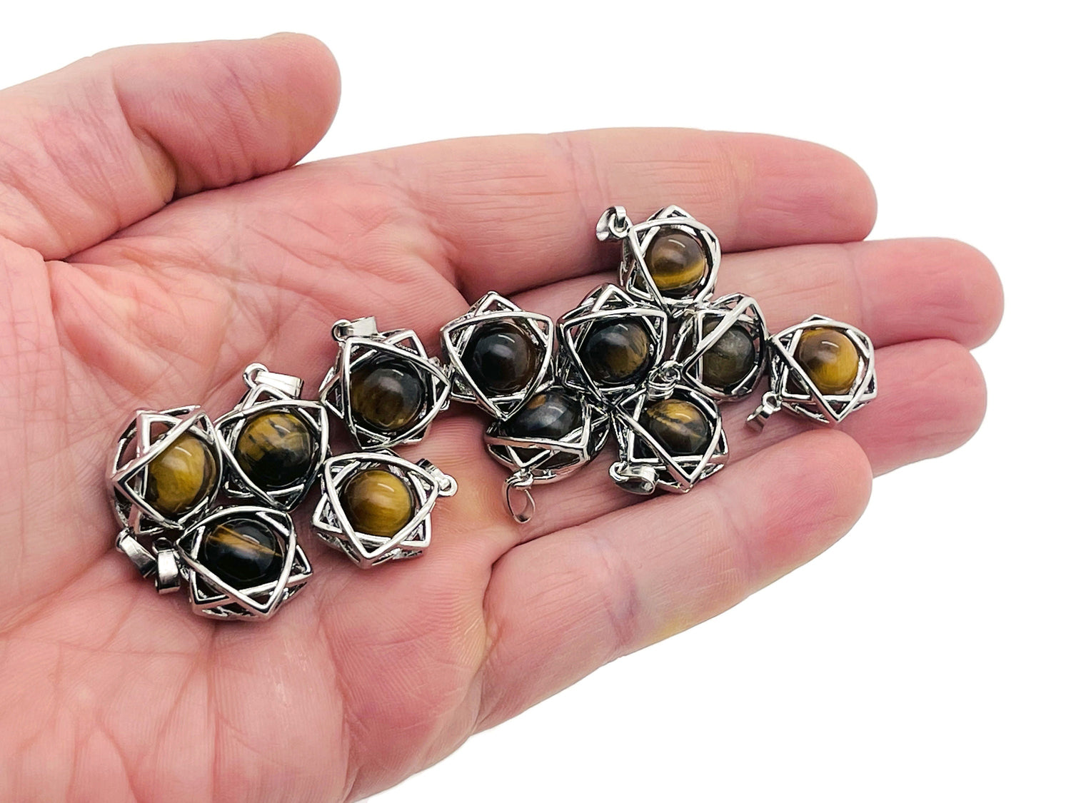 Tiger Eye crystal pendant necklace from GemstoneGO featuring a polished, oval-shaped gemstone on a silver chain.