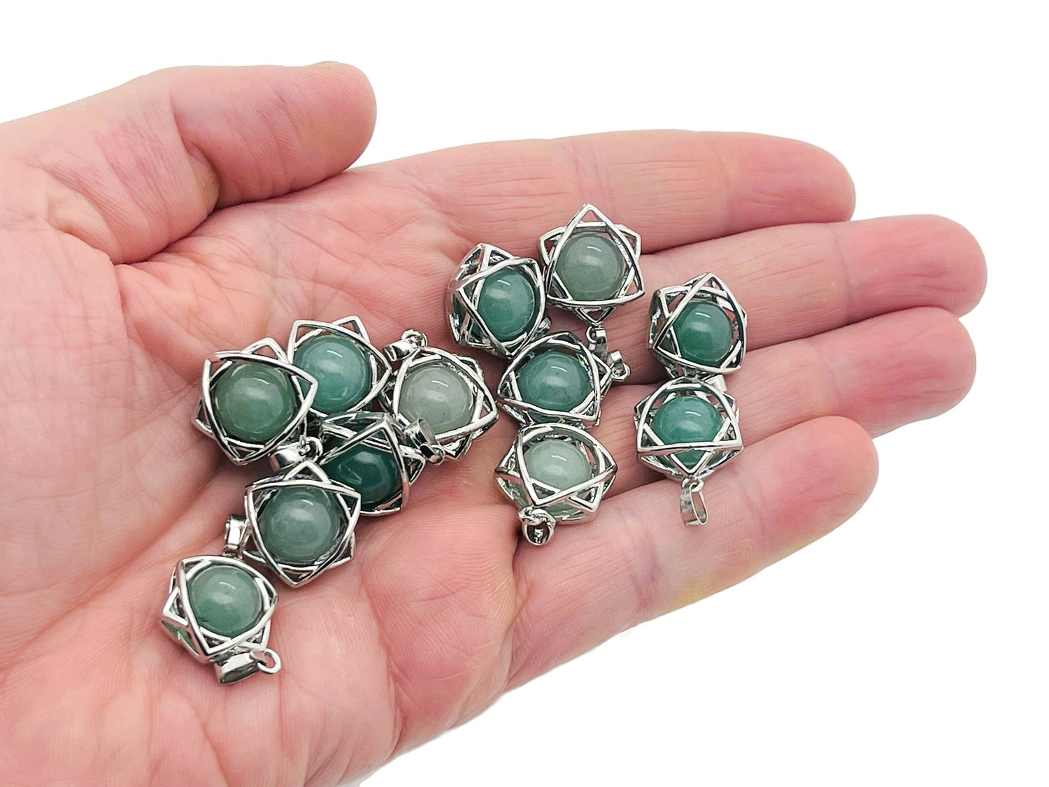 Aventurine crystal pendant jewelry featuring a smooth, polished green gemstone on a silver chain.