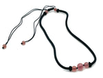 Strawberry Quartz sphere crystal necklace by GemstoneGO featuring a polished pink quartz pendant on a silver chain.