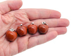 Red Jasper apple-shaped crystal pendant from GemstoneGO, featuring a mini crystal design with vibrant red stone and detailed craftsmanship.