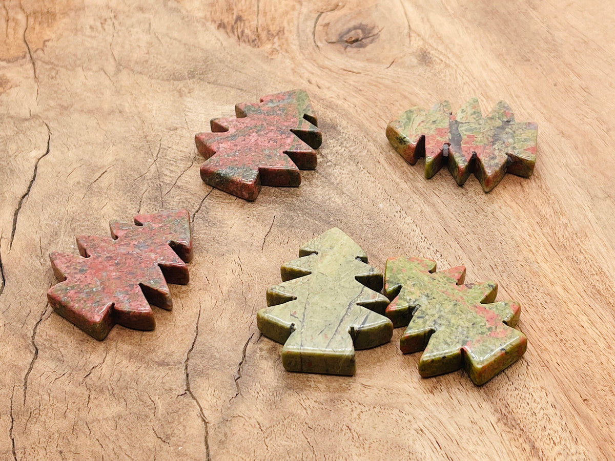 Handmade Unakite pine tree gemstone carving from GemstoneGO, showcasing detailed green and pink stone craftsmanship.