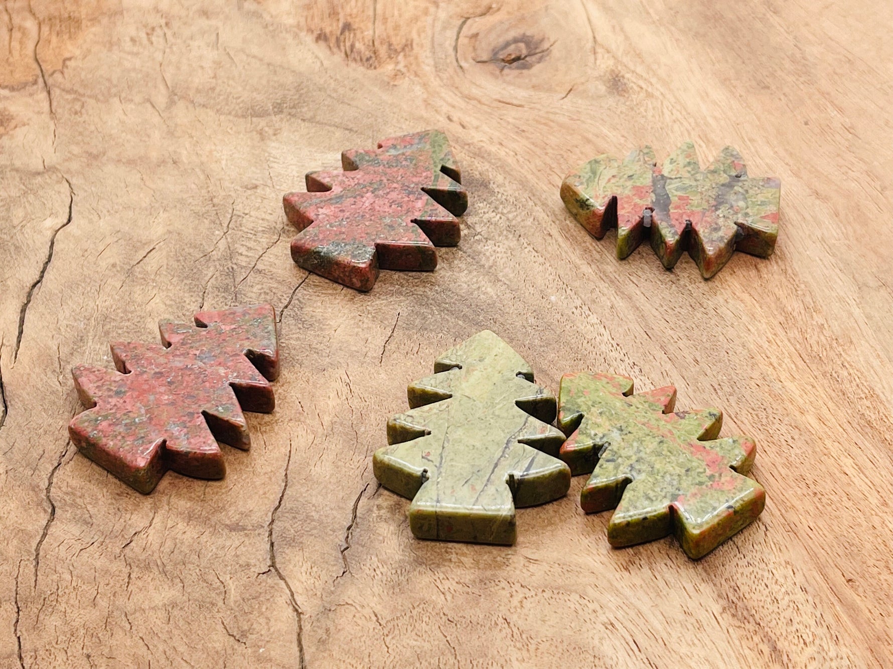 Handmade Unakite pine tree gemstone carving from GemstoneGO, showcasing detailed green and pink stone craftsmanship.