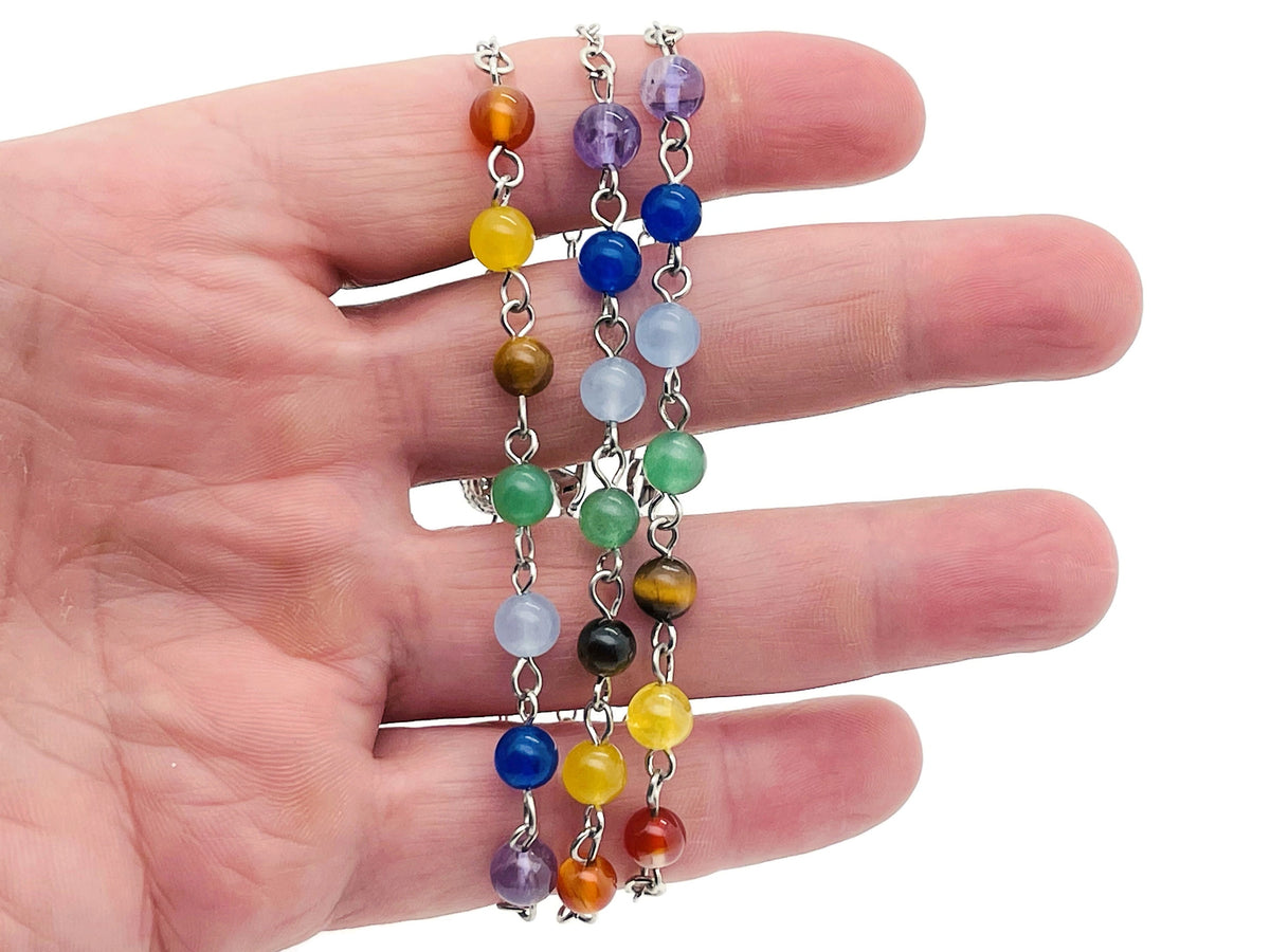 Colorful crystal chakra bracelet with seven stones from GemstoneGO, featuring a variety of polished gemstone beads.