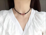 Strawberry quartz sphere crystal necklace with a polished, round gemstone pendant on a delicate chain, showcasing vibrant pink tones.