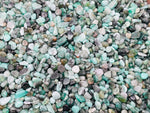 Semi-tumbled emerald crystal chips from GemstoneGO, 2-6mm bulk gemstone for jewelry or crafts in vibrant green color.