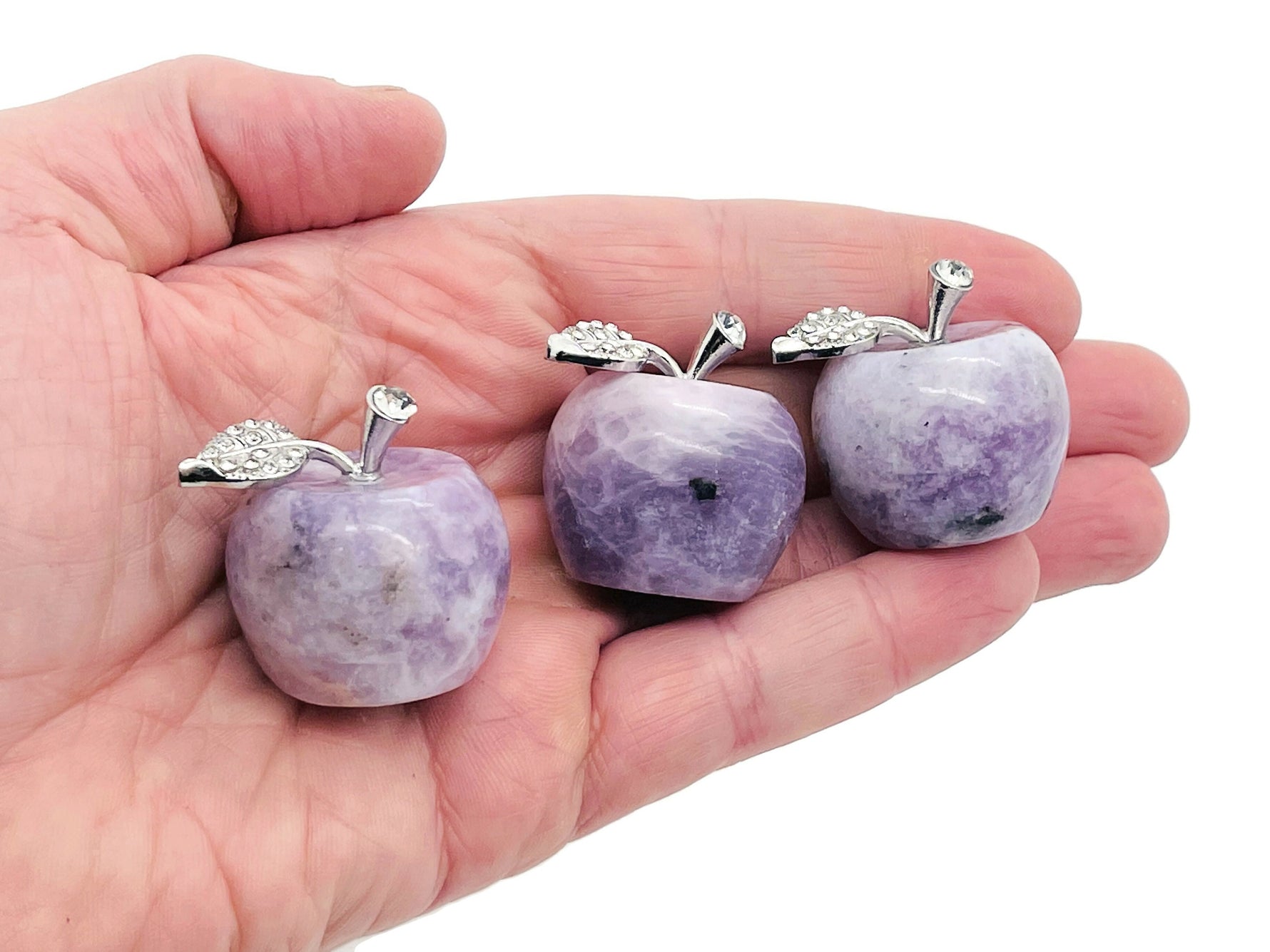 Lepidolite apple-shaped crystal carving from GemstoneGO, 30mm gemstone with purple and pink hues, detailed polished stone.