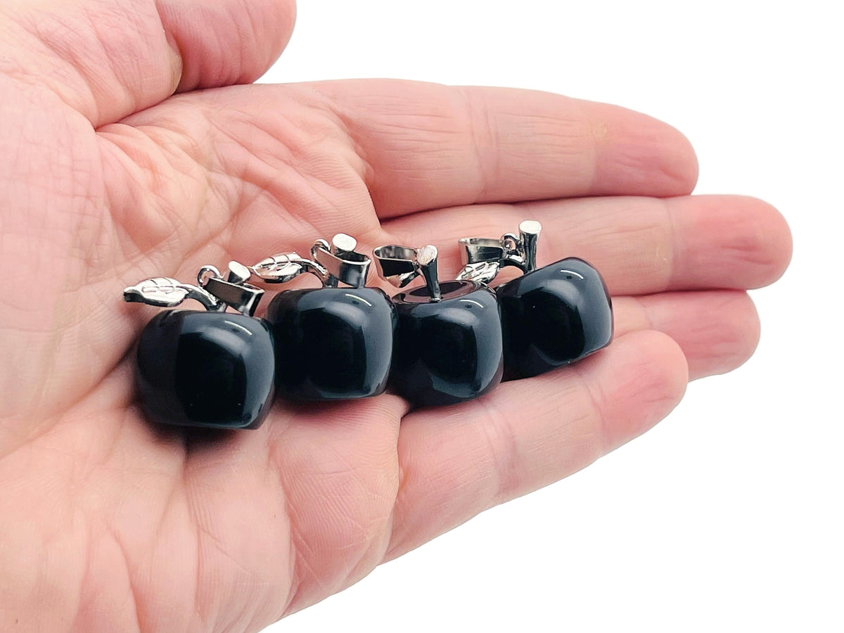 Mini obsidian apple crystal pendant from GemstoneGO featuring a black gemstone carved into an apple shape.