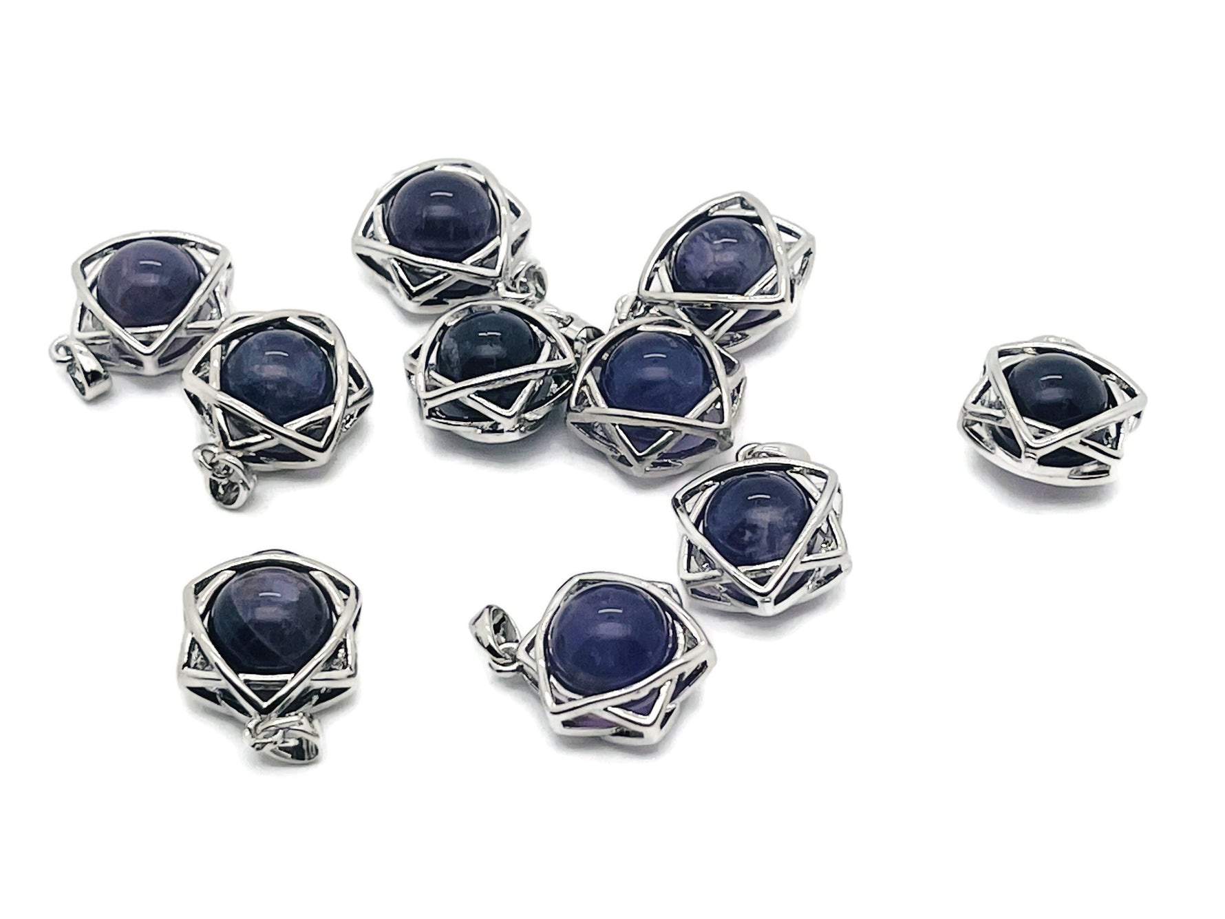 Amethyst crystal pendant jewelry featuring a polished purple gemstone on a silver chain, showcasing elegant gemstone craftsmanship.
