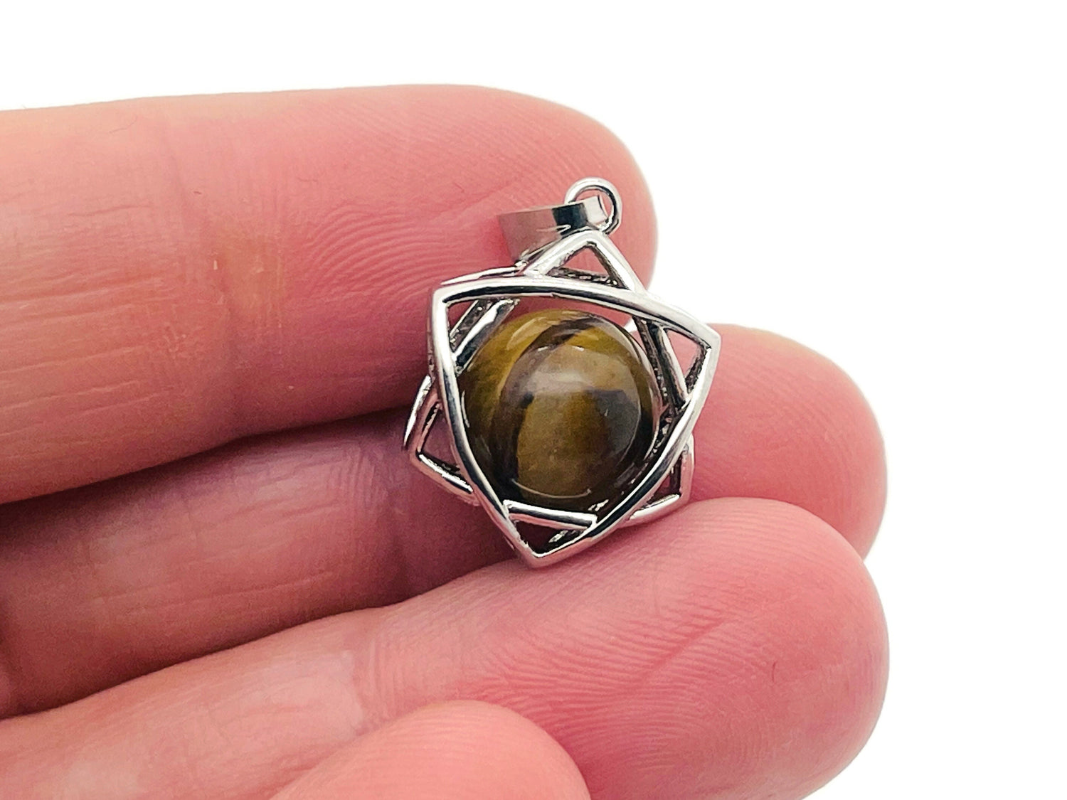 Tiger Eye crystal pendant necklace from GemstoneGO featuring a polished gemstone on a silver chain.