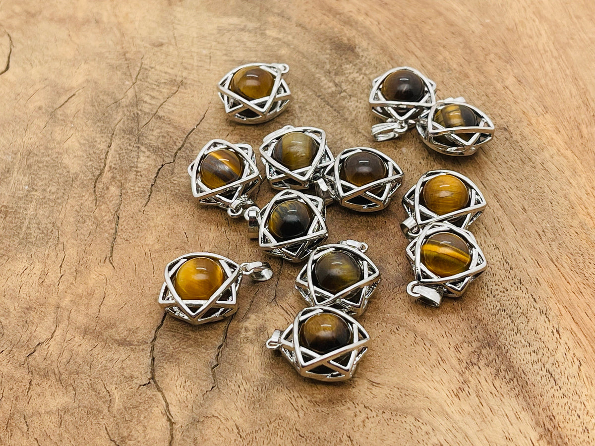 Tiger Eye crystal pendant jewelry from GemstoneGO, featuring a polished oval gemstone on a silver chain.