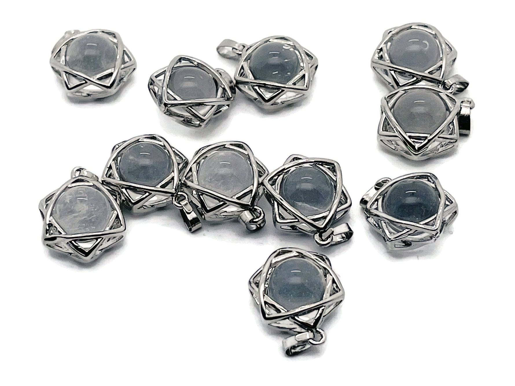 Clear quartz crystals pendant with a natural gemstone design, featuring a silver setting, from GemstoneGO jewelry collection.