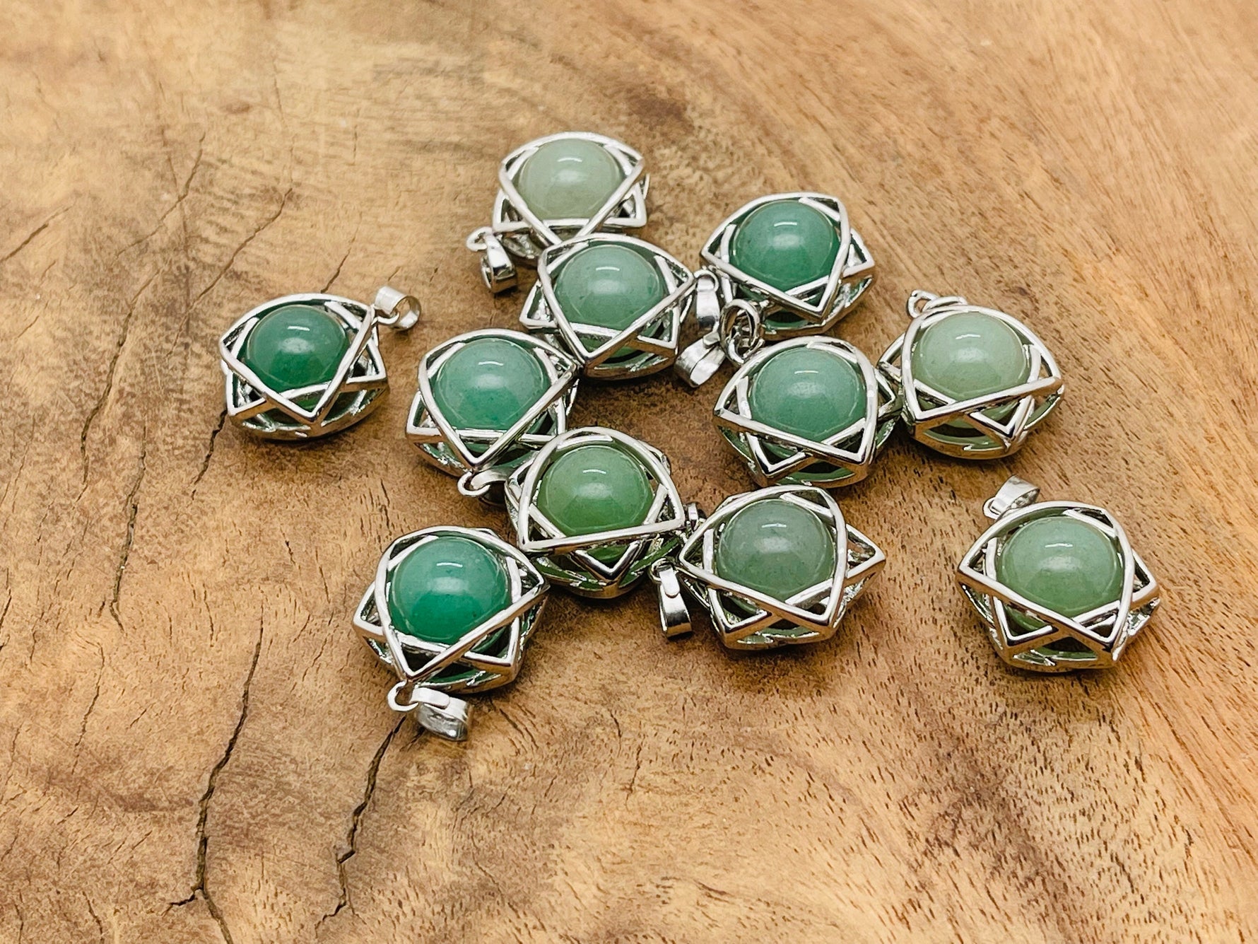 Aventurine crystal pendant necklace from GemstoneGO featuring a polished green aventurine stone on a silver chain.