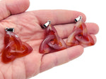Carnelian Celtic knot crystal pendant from GemstoneGO featuring a Trinity crystals design on a silver setting.