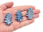 Blue Spot Jasper pine tree carving gemstone, handmade tree stone with intricate details, natural blue and brown mineral patterns.