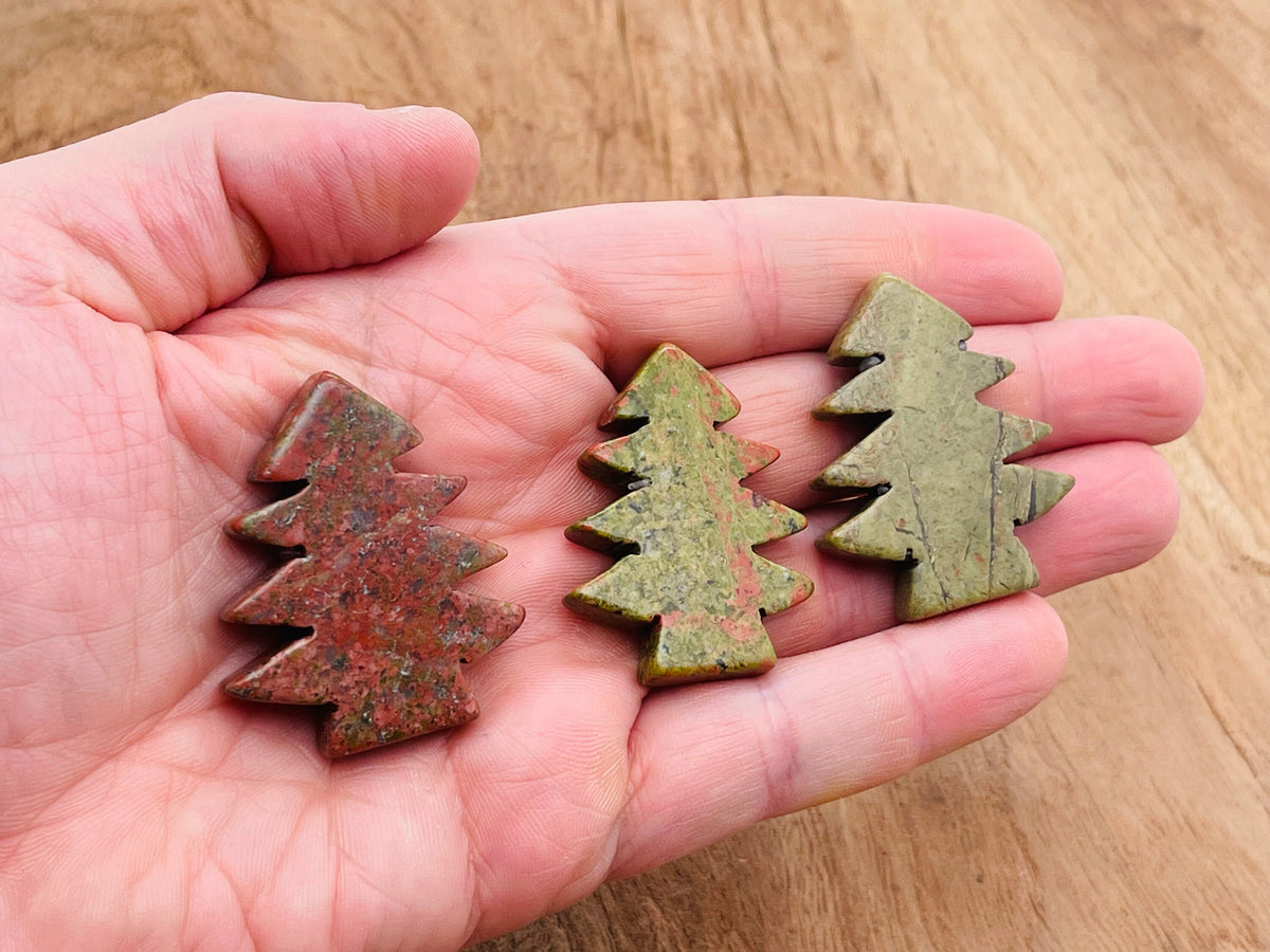 Handmade Unakite pine tree gemstone carving with detailed tree shape and natural green and pink hues, crafted by GemstoneGO.