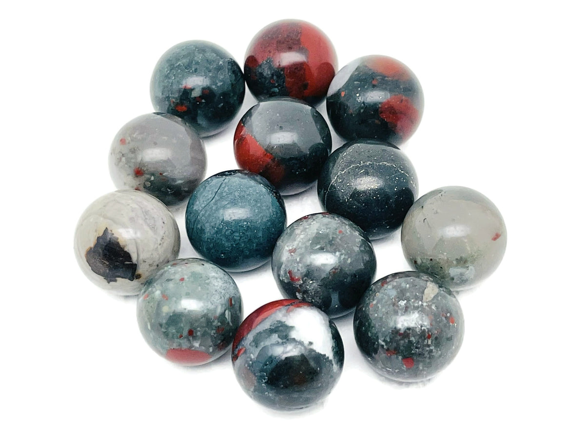 20mm African Bloodstone sphere gemstone showing deep green and red mineral patterns, polished crystal ball for display or collection.