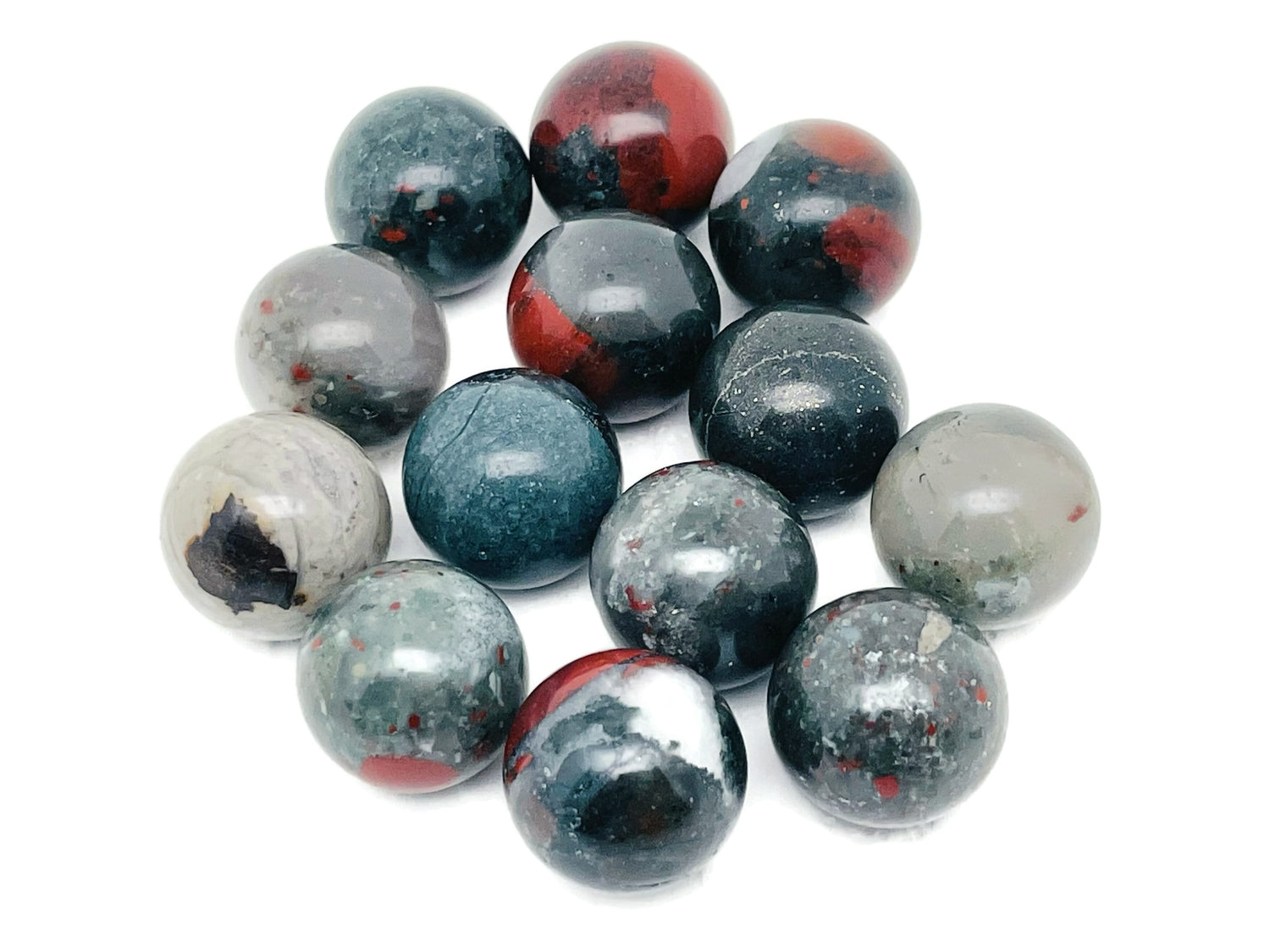 20mm African Bloodstone sphere gemstone showing deep green and red mineral patterns, polished crystal ball for display or collection.