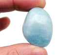 Smooth aquamarine tumbled stone from GemstoneGO, showcasing its light blue color and polished, rounded surface.