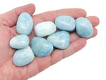 Aquamarine tumbled gemstone from GemstoneGO, smooth blue-green mineral with polished surface, used for jewelry or healing.