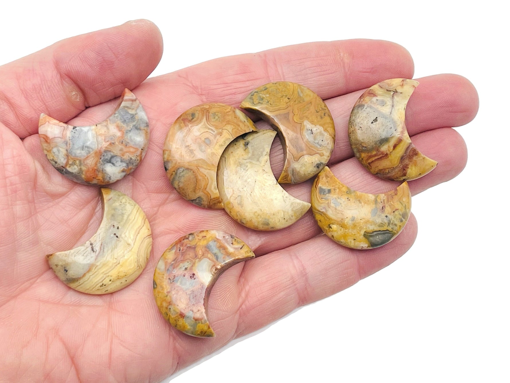 30mm Crazy Lace Agate gemstone moon pendant from GemstoneGO, featuring vibrant, intricate lace patterns on a polished stone surface.