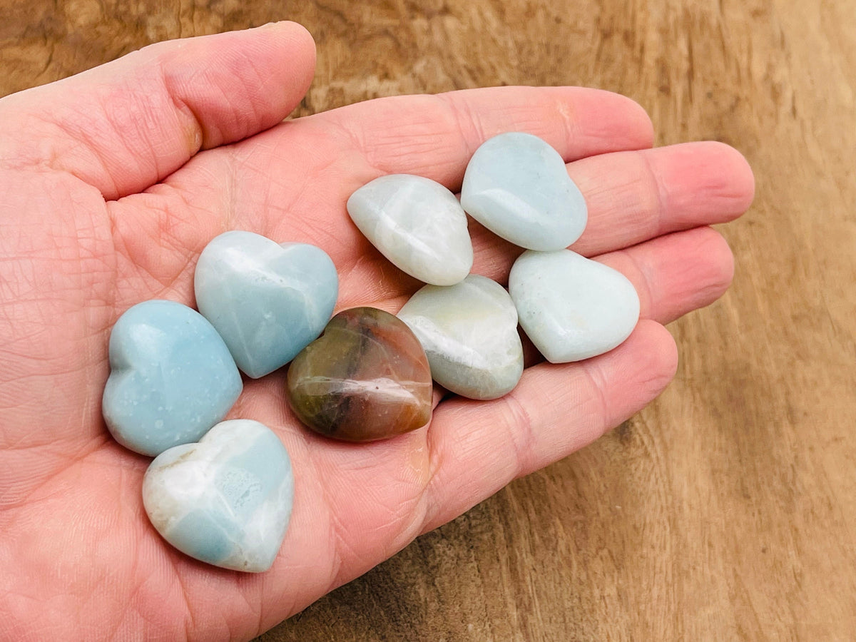 Amazonite heart-shaped gemstone pendant, 25mm, from GemstoneGO, showcasing its vibrant blue-green color and polished surface.