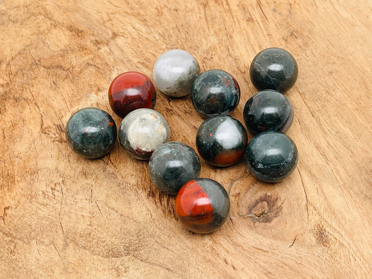 20mm African Bloodstone sphere gemstone with rich green and red mineral patterns, showcasing natural crystal ball beauty.