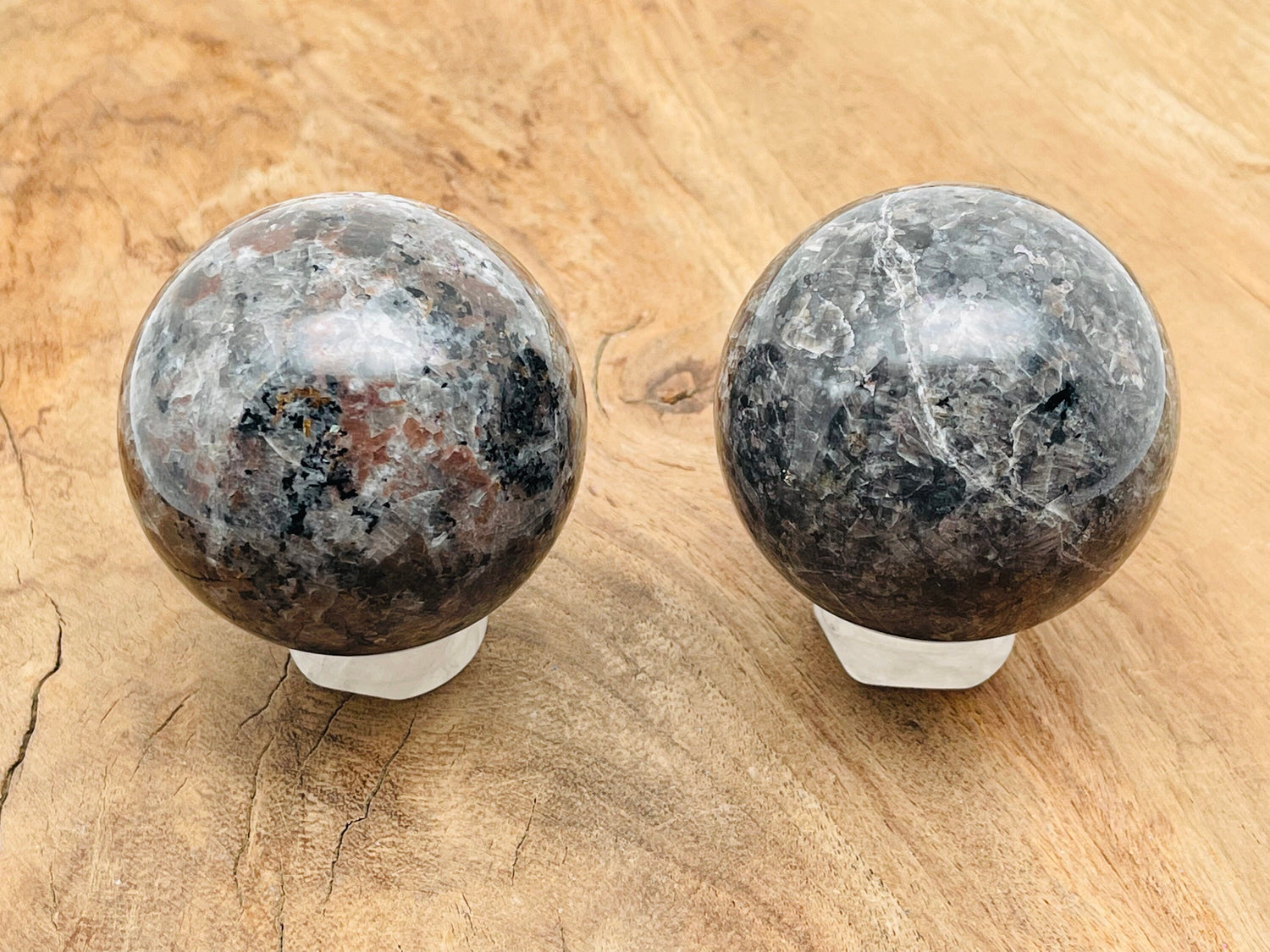 Yooperlite sphere gemstone featuring fluorescent sodalite, 55-60mm crystal ball showcasing vibrant glow under UV light.