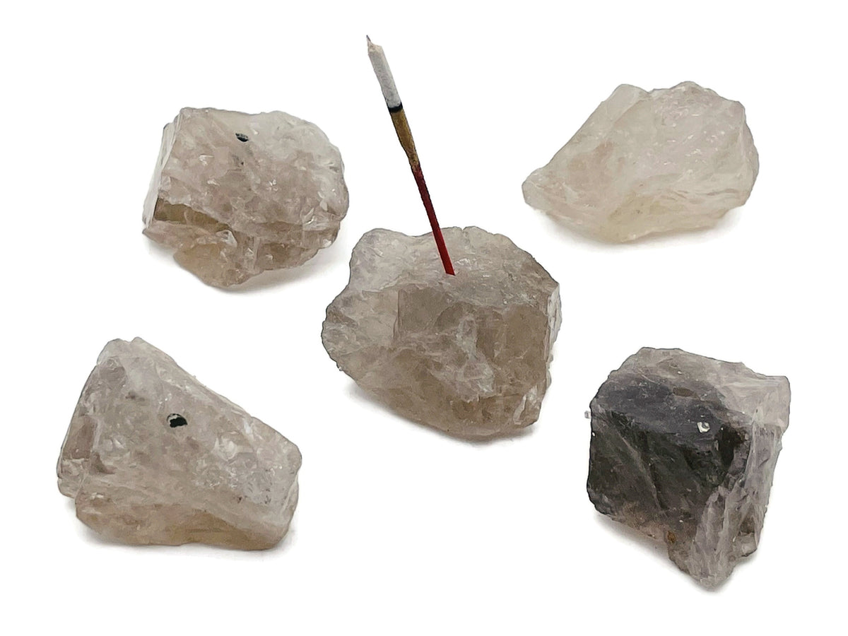 Handmade smoky quartz rough crystal incense holder with carved design, ideal for holding incense sticks in a natural gemstone setting.