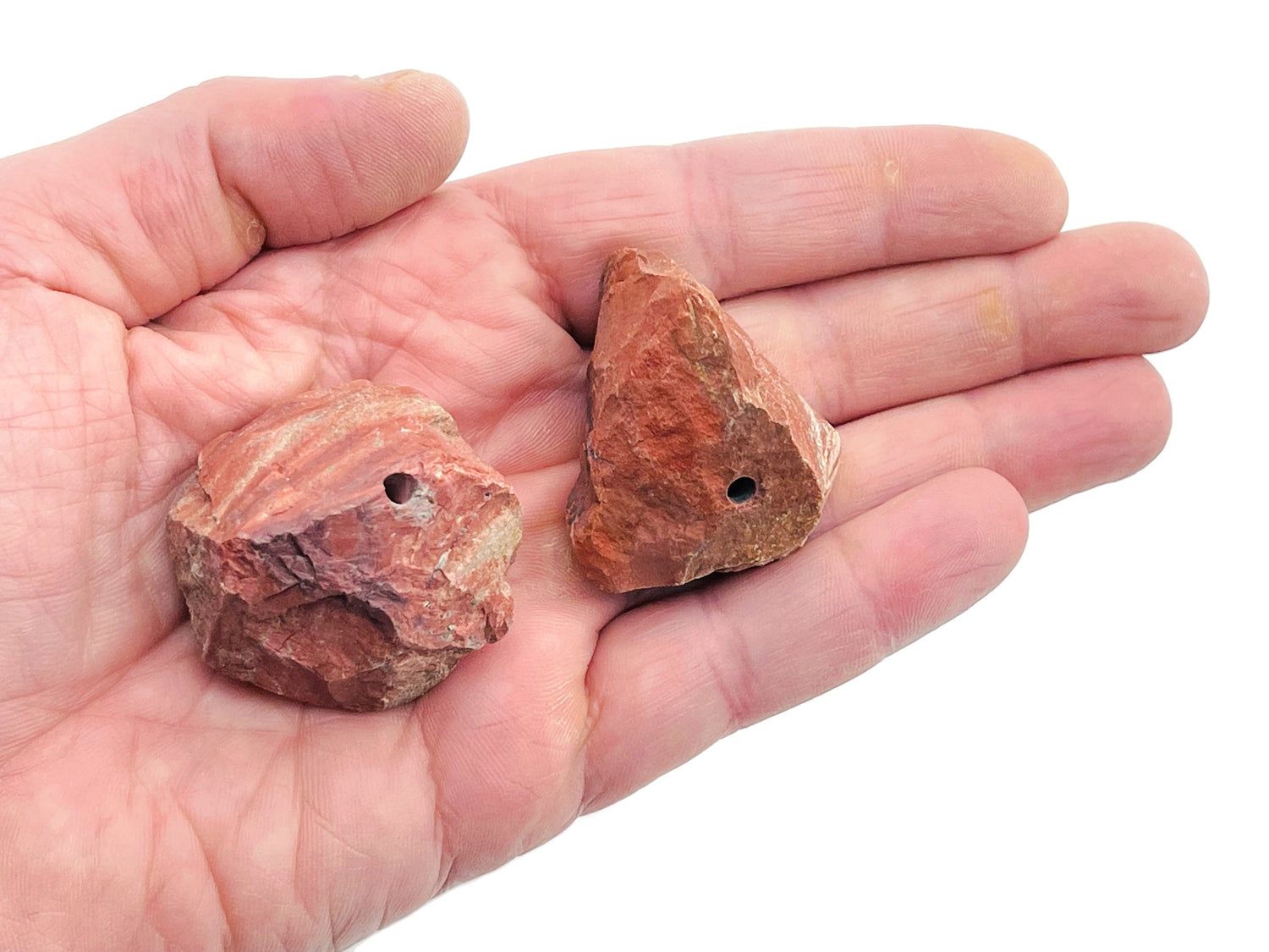 Handmade red jasper rough crystal incense holder with carved design, ideal for holding incense sticks.