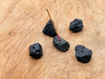 Black tourmaline rough crystal incense holder from GemstoneGO, handcrafted with natural carving, designed for incense sticks.