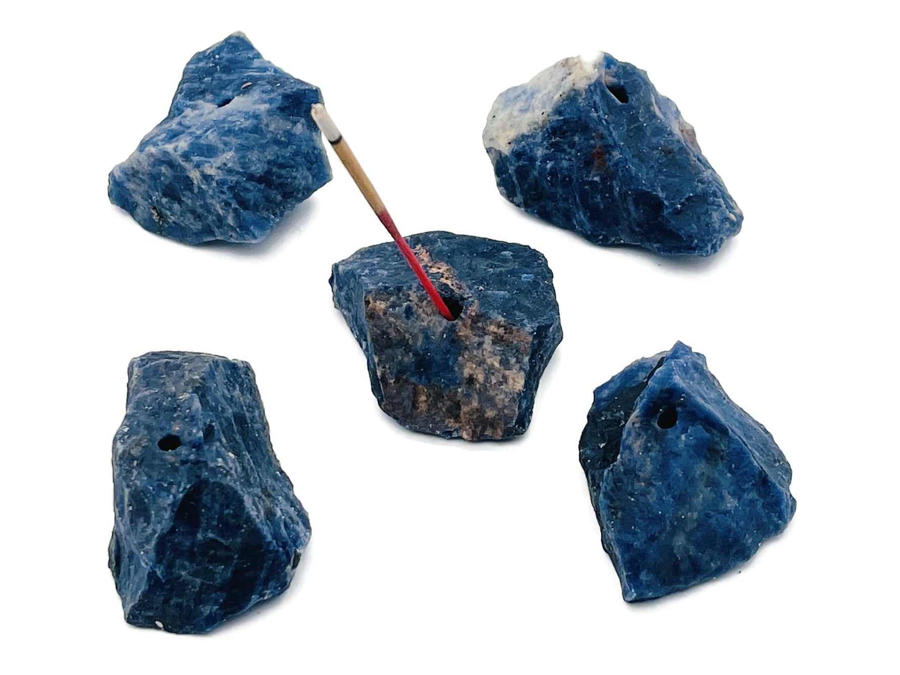 Handmade sodalite rough crystal incense holder with carved design, featuring a natural blue and white gemstone appearance.