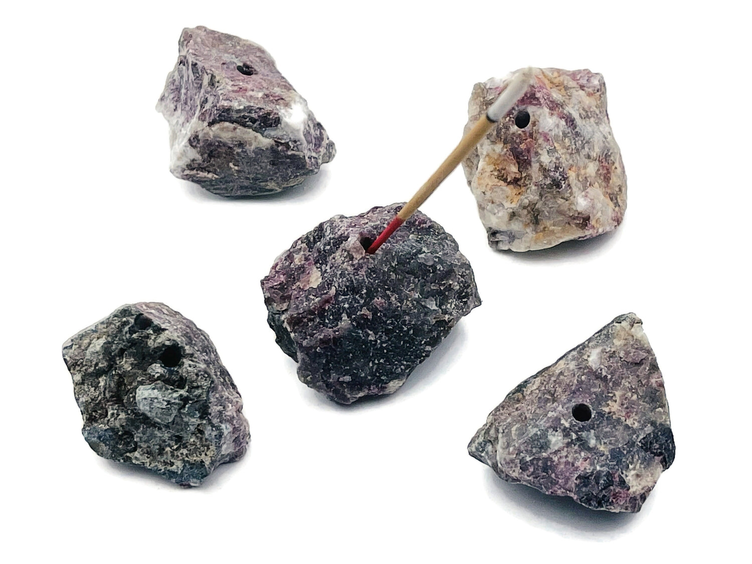 Handmade plum blossom carved tourmaline crystal incense holder with a carved design, ideal for holding incense sticks.