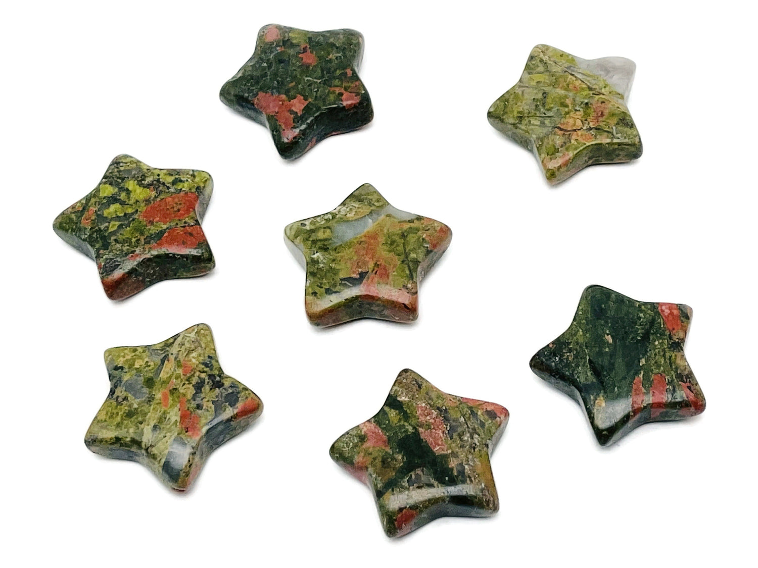 Unakite star-shaped gemstone, 30mm, from GemstoneGO, showcasing pink and green mineral patterns on a polished surface.