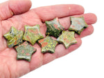 Unakite star-shaped gemstone, 30mm, from GemstoneGO, showcasing a vibrant green and pink mineral pattern.