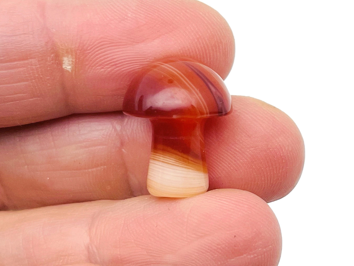 Carnelian mushroom carved gemstone, 20mm, featuring detailed mushroom shape with vibrant orange-red color and smooth polished surface.