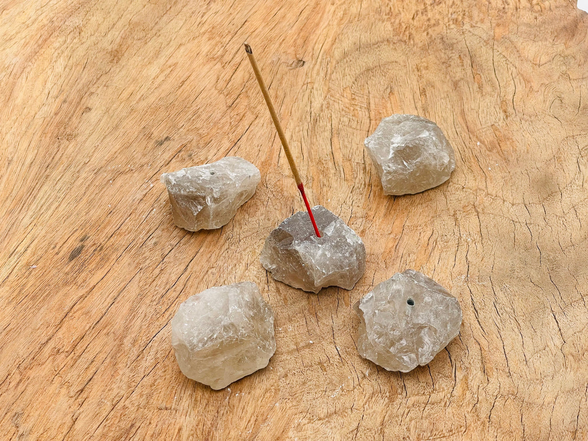 Handmade smoky quartz rough crystal incense holder with carved design, perfect for holding incense sticks.