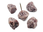 Handmade strawberry quartz rough crystal incense holder with carved design, perfect for holding incense sticks.