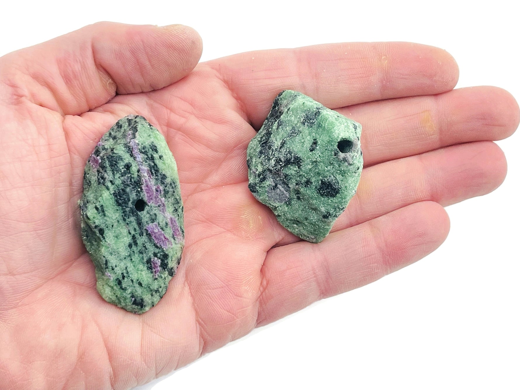 Handmade Ruby Zoisite rough crystal incense holder with carved design, used for holding incense sticks for aromatic burning.