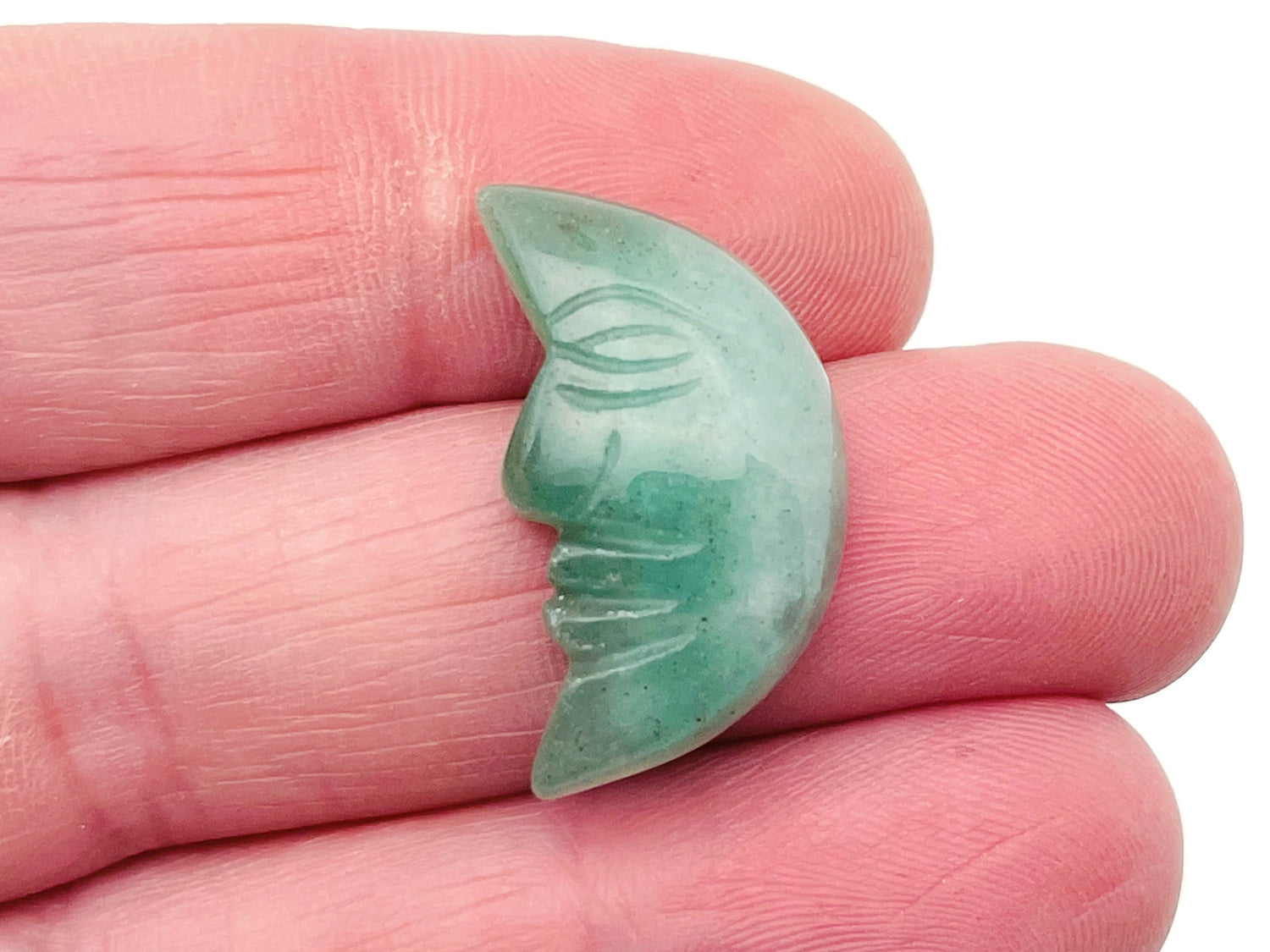 A 25mm aventurine crystal moon face pendant with a smiling expression, handcrafted gemstone from GemstoneGO.