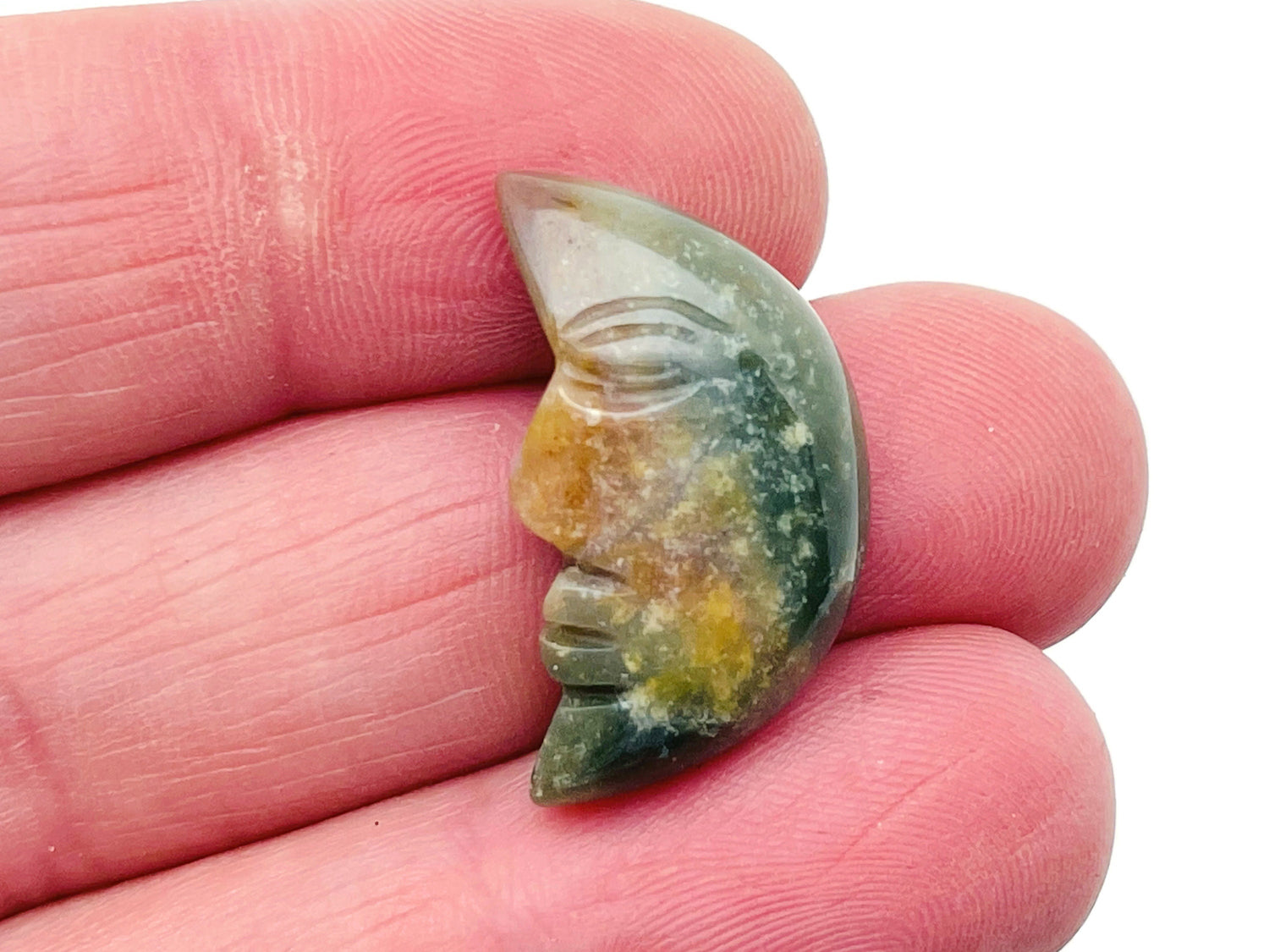 African Bloodstone crystal moon face pendant, 25mm, featuring a carved smiling moon design by GemstoneGO.