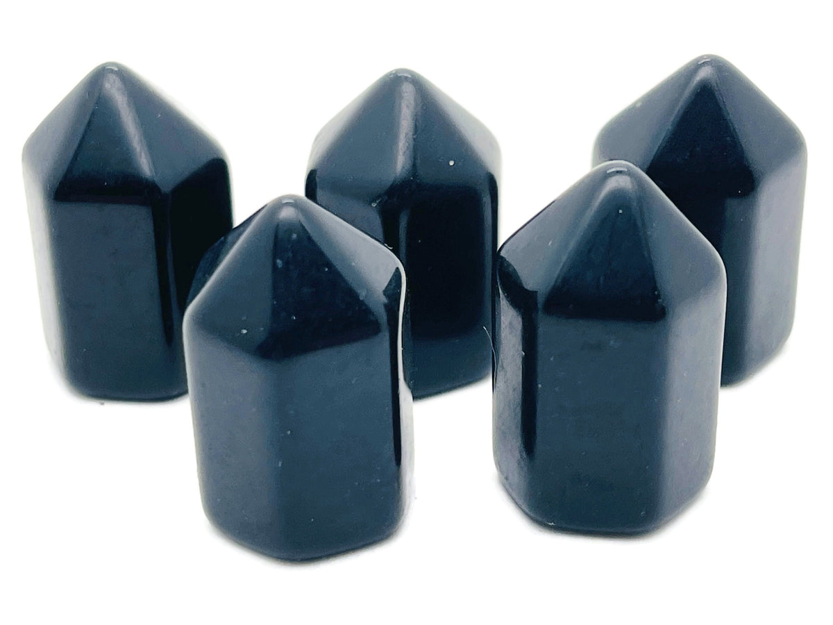 Polished 25mm black obsidian obelisk tower crystal from GemstoneGO, showcasing a sleek, glossy black stone sculpture.