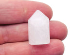 Clear Quartz obelisk tower crystal, 25mm, from GemstoneGO, showcasing a translucent, polished pointed gemstone.
