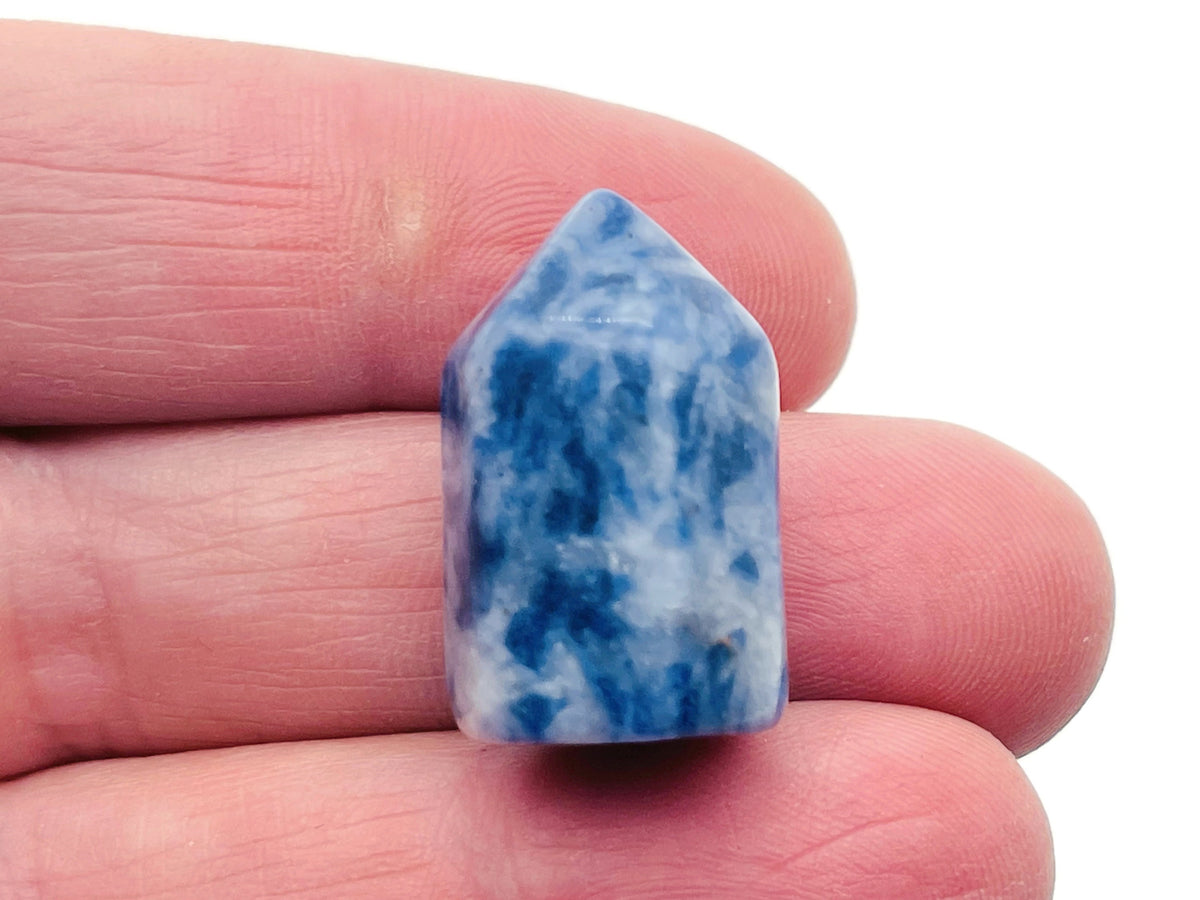 Blue Spot Jasper obelisk tower crystal from GemstoneGO, showcasing a polished blue and brown stone with natural patterns.