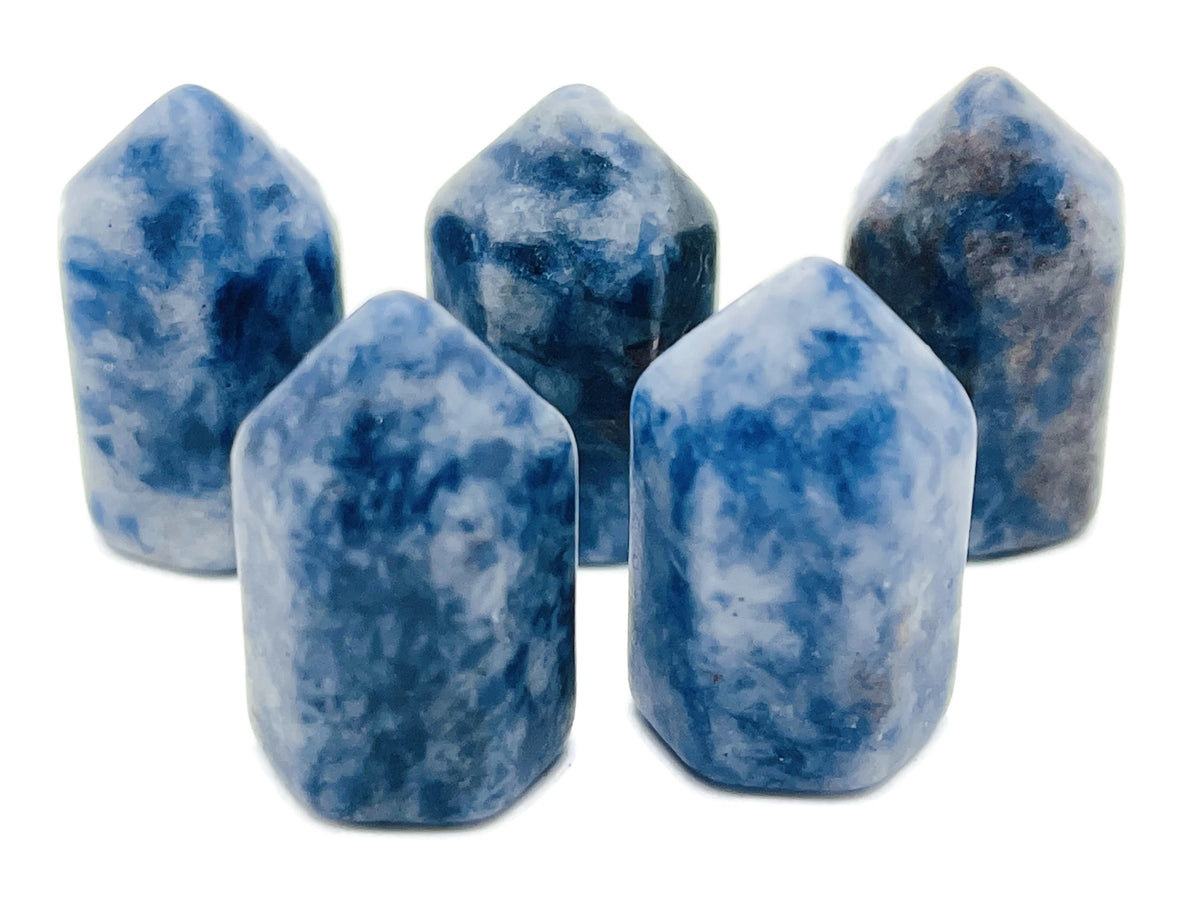 Blue Spot Jasper obelisk tower crystal from GemstoneGO showcasing a polished blue and brown gemstone sculpture.