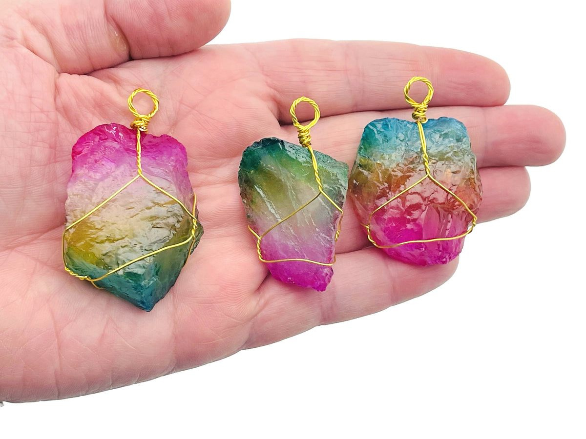 Brass wire wrapped Rainbow Aura Quartz gemstone pendant with vibrant rainbow colors, handcrafted jewelry piece from GemstoneGO.