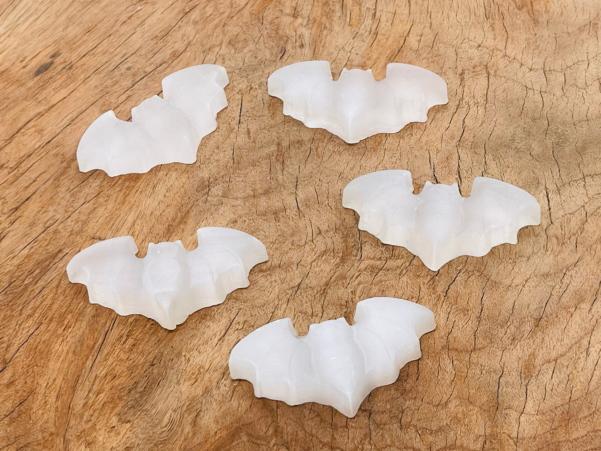 Selenite bad carving gemstone from GemstoneGO with intricate natural crystal details and smooth carved surface.
