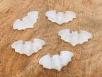 Selenite bad carving gemstone from GemstoneGO with intricate natural crystal details and smooth carved surface.