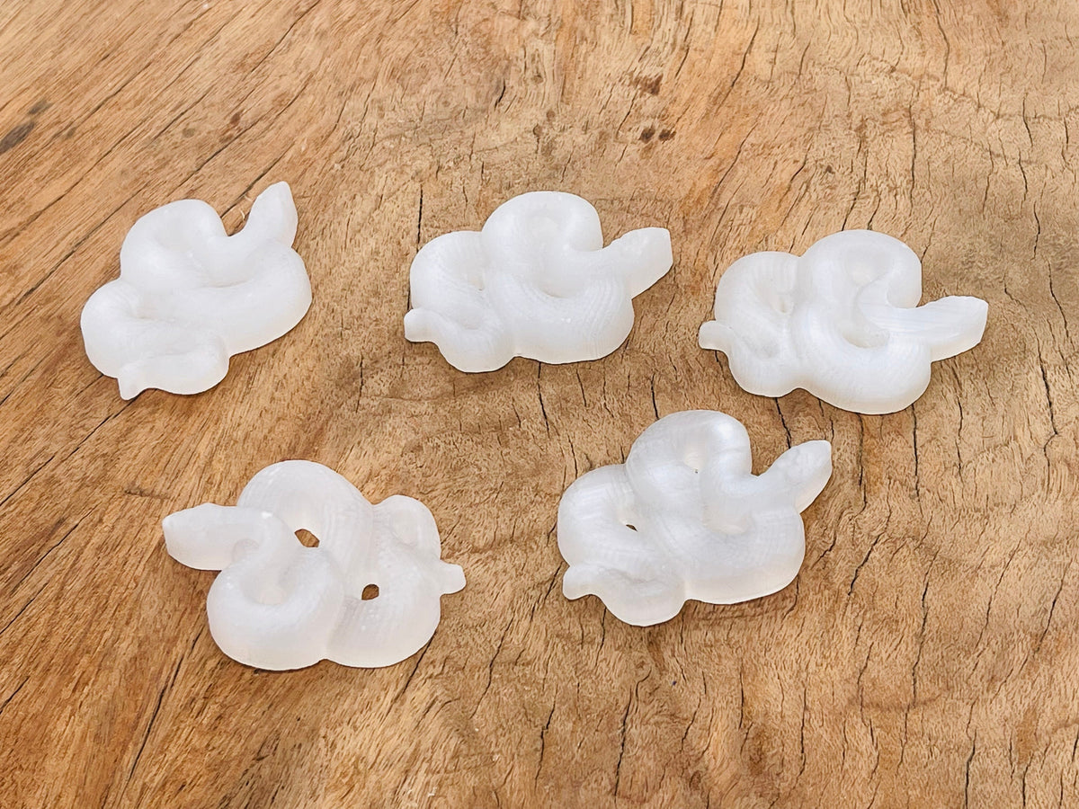 Selenite snake carving gemstone from GemstoneGO, showcasing a smooth, polished white selenite sculpture with intricate snake details.